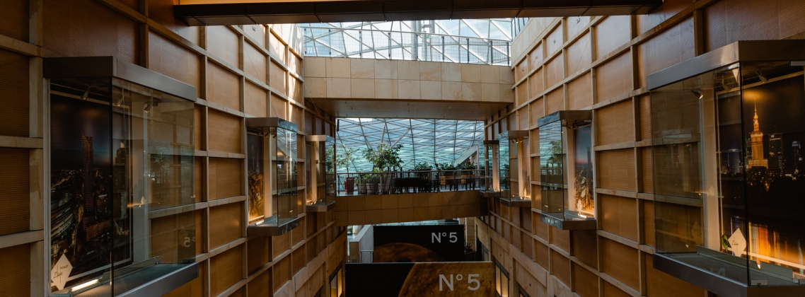 Illustration of AI technology optimizing commercial real estate operations, with icons representing lease management, analytics, chatbots, and investment strategy.