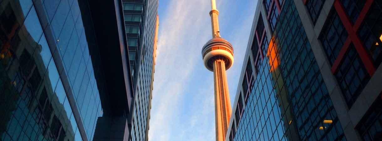 Canadian accountant reviewing lease documents and financial reports to comply with ASPE 3065 lease accounting standards